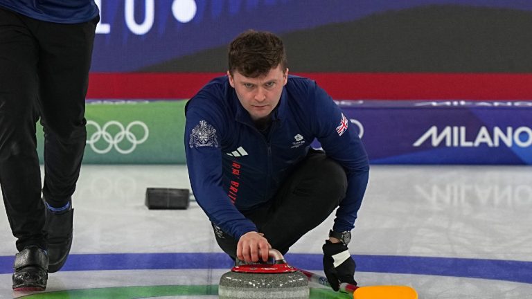 Britain's Bruce Mouat, centre, competes during a men's curling gold medal match between Britain and Canada, at the 2026 Winter Olympics, in Cortina d'Ampezzo, Italy, Saturday, Feb. 21, 2026. (Fatima Shbair/AP)