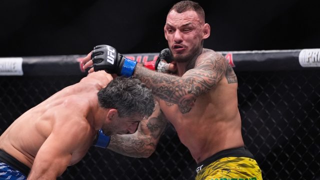 Beneil-Dariush-hits-Renato-Moicano-in-a-lightweight-fight-at-a-UFC-event